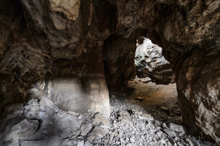 Archeologists uncover evidence of intentional-burial cave engravings by early human ancestor